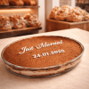 Just Married tiramisu dessert in glass dish displayed in artisan bakery with fresh bread shelves in background